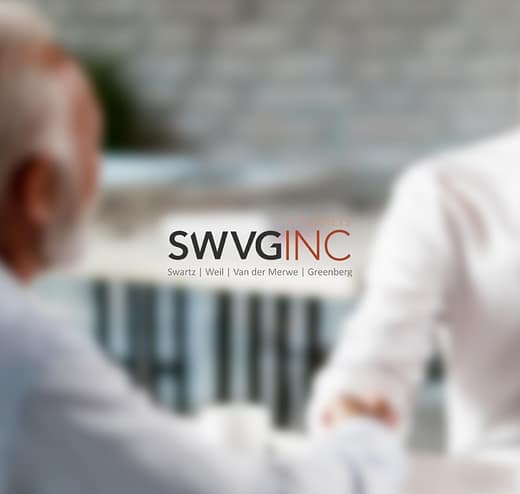 SWVG Inc Attorneys – Dispute Resolution Two people shaking hands in a business meeting, symbolising negotiation, mediation and arbitration to resolve disputes.