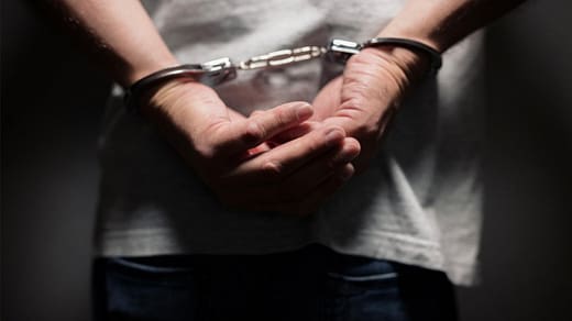 Criminal Defence Lawyers – Bail & Urgent Legal Help – SWVG Inc. Close-up of a person in handcuffs, representing urgent legal defence and criminal law expertise at SWVG Inc.