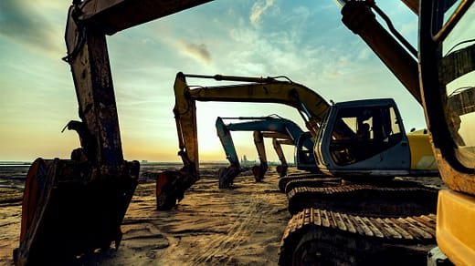 Mining & Mineral Rights Lawyers – SWVG Inc. Excavators on a mining site at sunset, symbolising SWVG Inc.'s legal expertise in South African mining law, safety compliance, and mineral rights transactions.