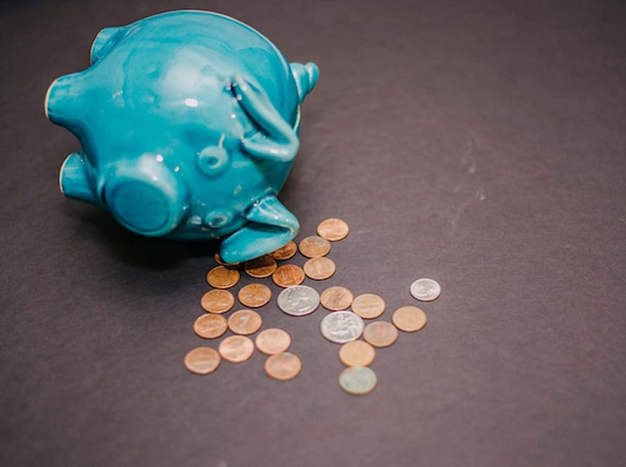 Tipped-over blue piggy bank with scattered coins symbolising financial protection for attorneys in a landmark Supreme Court of Appeal decision.